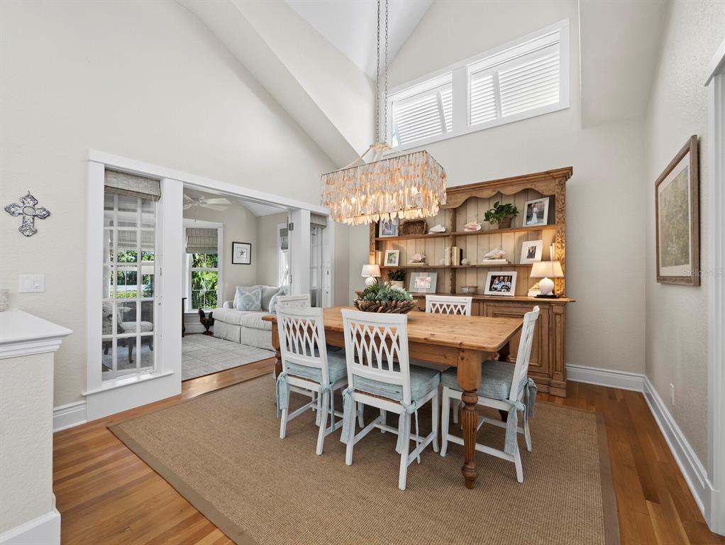 160 Blackwall Court Boca Grande, FL 33921 - Photo 9 of 56 a view of a dining room with furniture and wooden floor