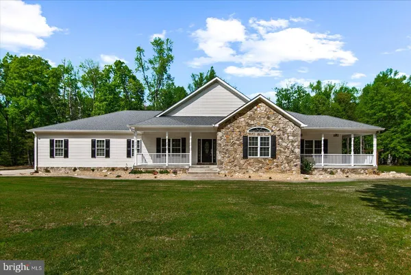 a view of a house with a big yard