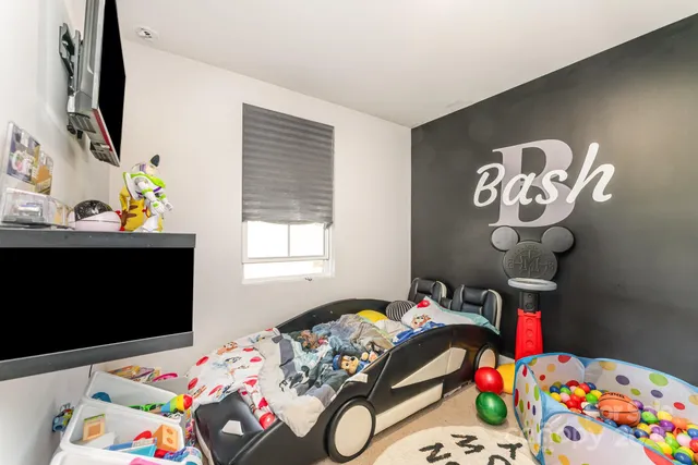 a bedroom with a bed and a table in it