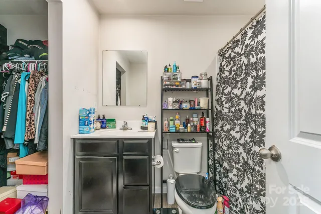 a kitchen with a refrigerator and a sink