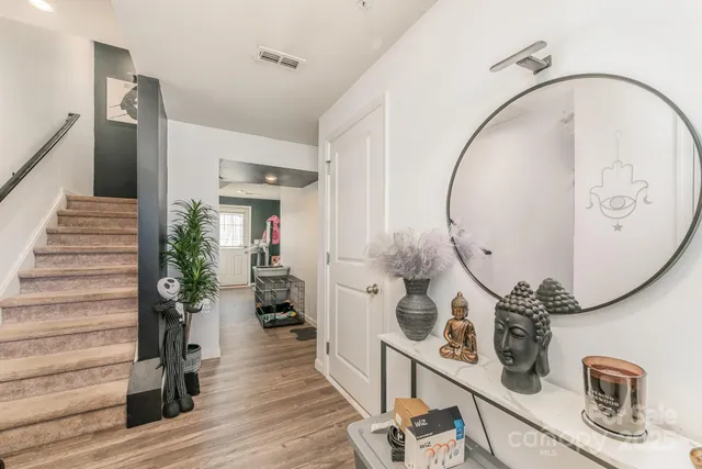 wooden floor with a potted plant on the table