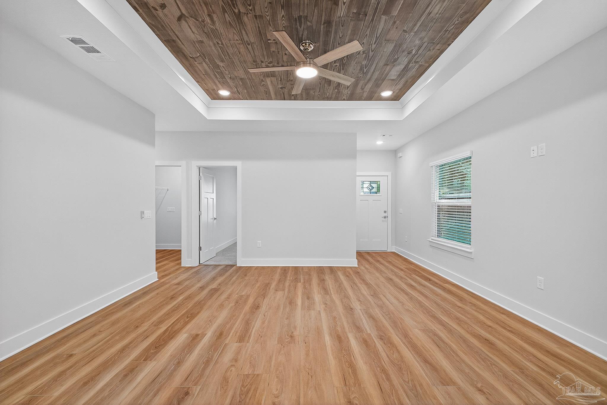 6115 Carroll Road Milton, FL 32583 - Photo 12 of 57 wooden floor in an empty room with a window