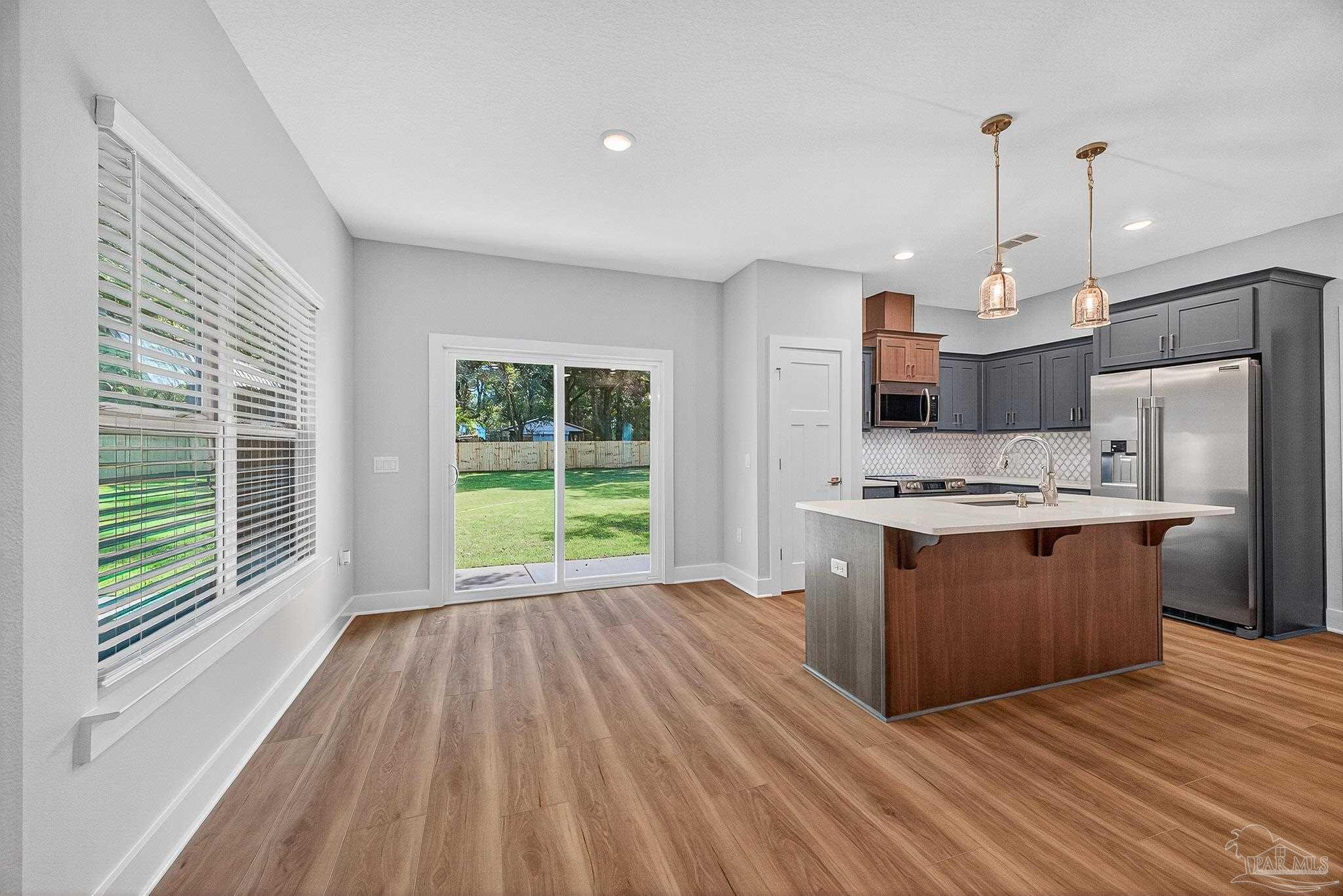 6115 Carroll Road Milton, FL 32583 - Photo 16 of 57 a view of kitchen with granite countertop window and a sink