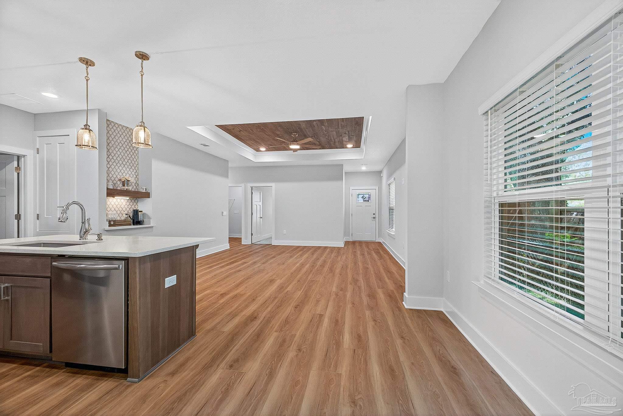 6115 Carroll Road Milton, FL 32583 - Photo 18 of 57 a view of a kitchen with a sink and wooden floor