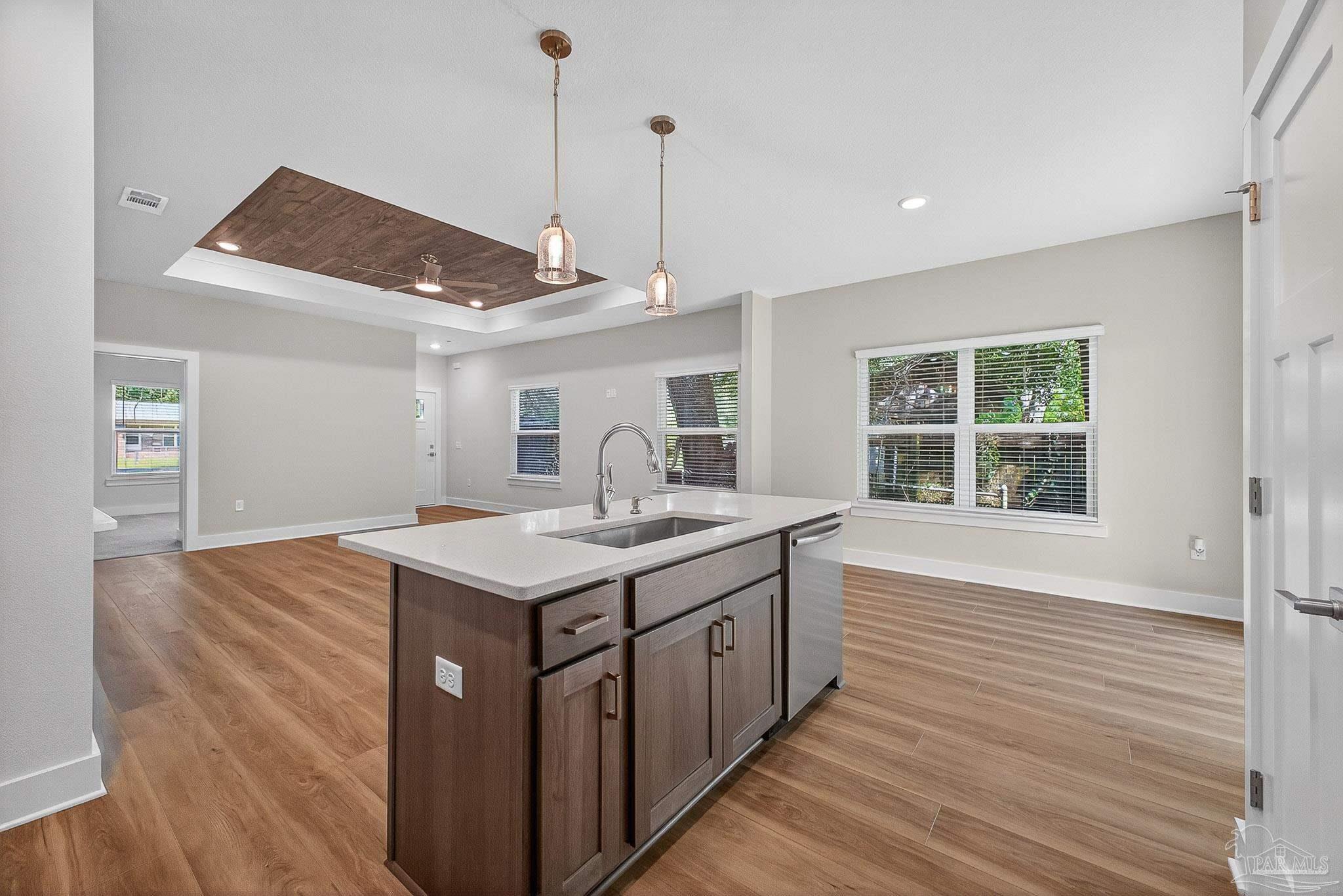 6115 Carroll Road Milton, FL 32583 - Photo 24 of 57 a kitchen with a stove and a wooden floor