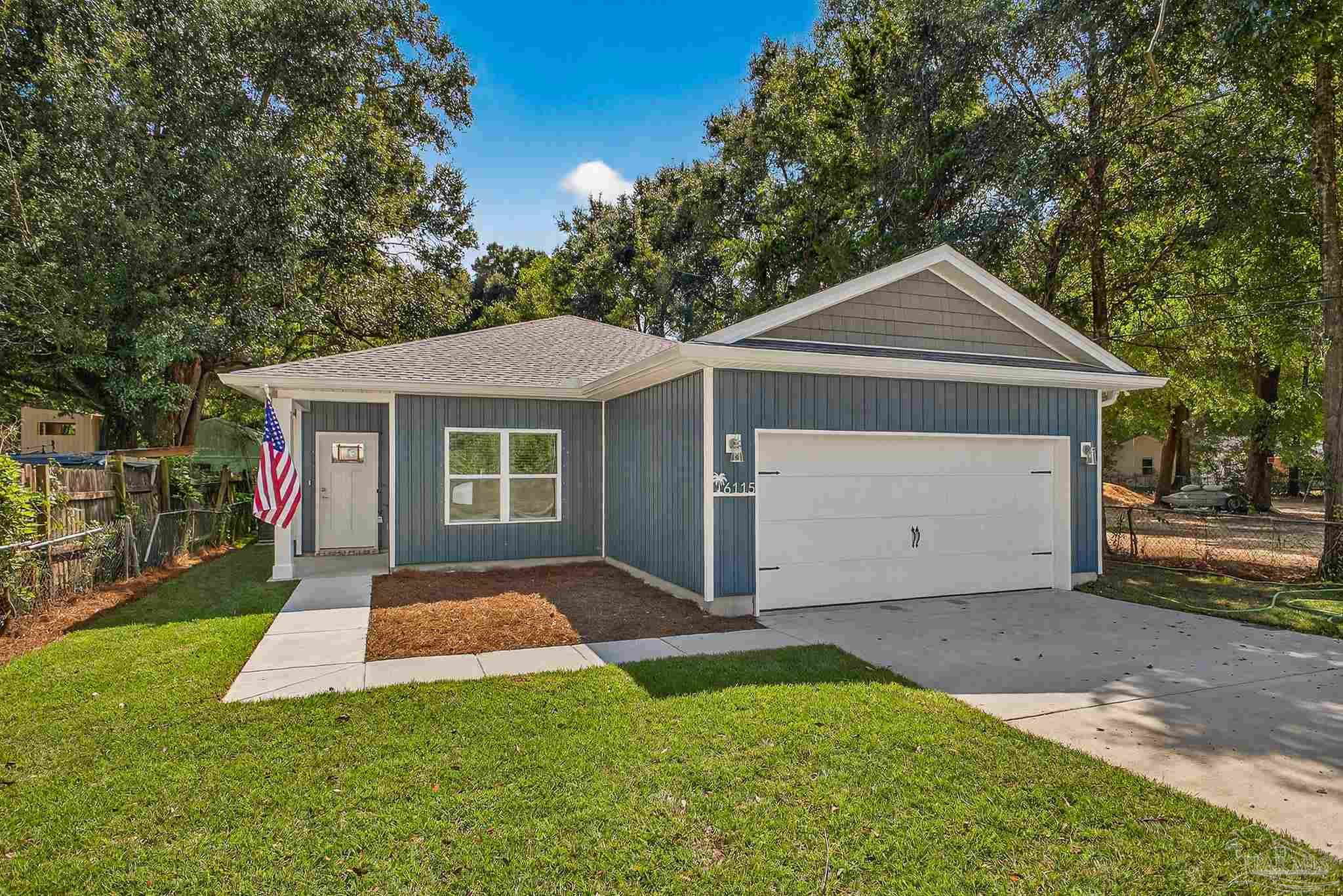 6115 Carroll Road Milton, FL 32583 - Photo 3 of 57 a front view of house with yard and green space