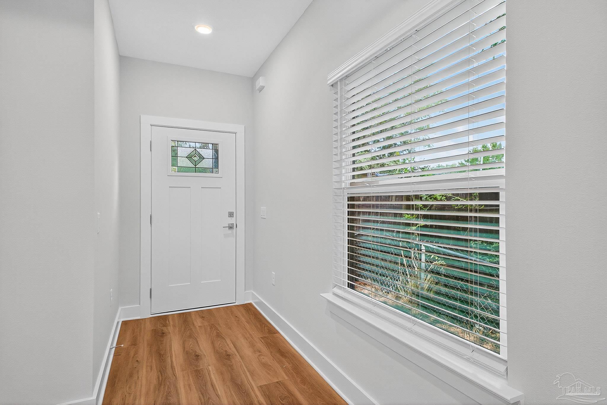 6115 Carroll Road Milton, FL 32583 - Photo 6 of 57 a view of a room that has a window in it