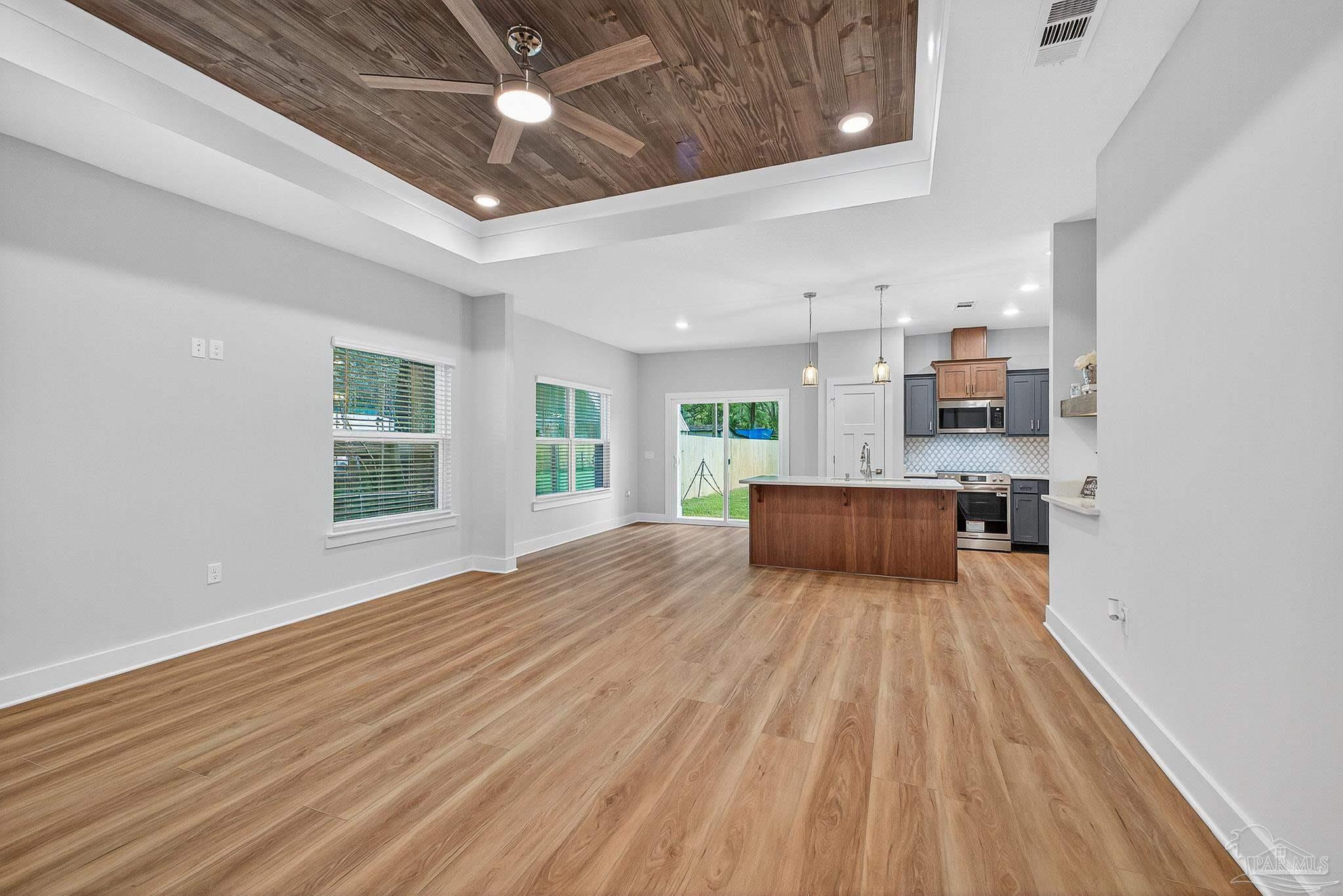 6115 Carroll Road Milton, FL 32583 - Photo 10 of 57 a large room with kitchen view