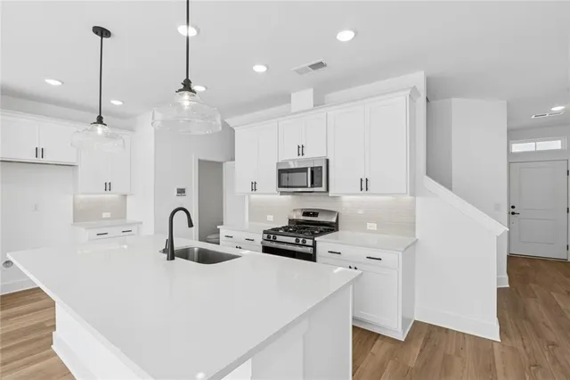 a bathroom with a sink and mirror