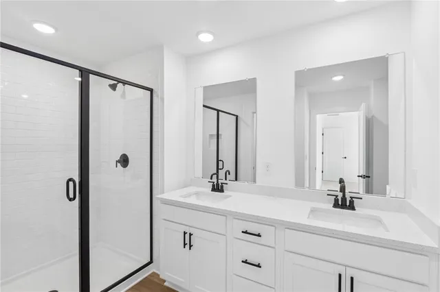 a bathroom with a sink mirror toilet and bathtub