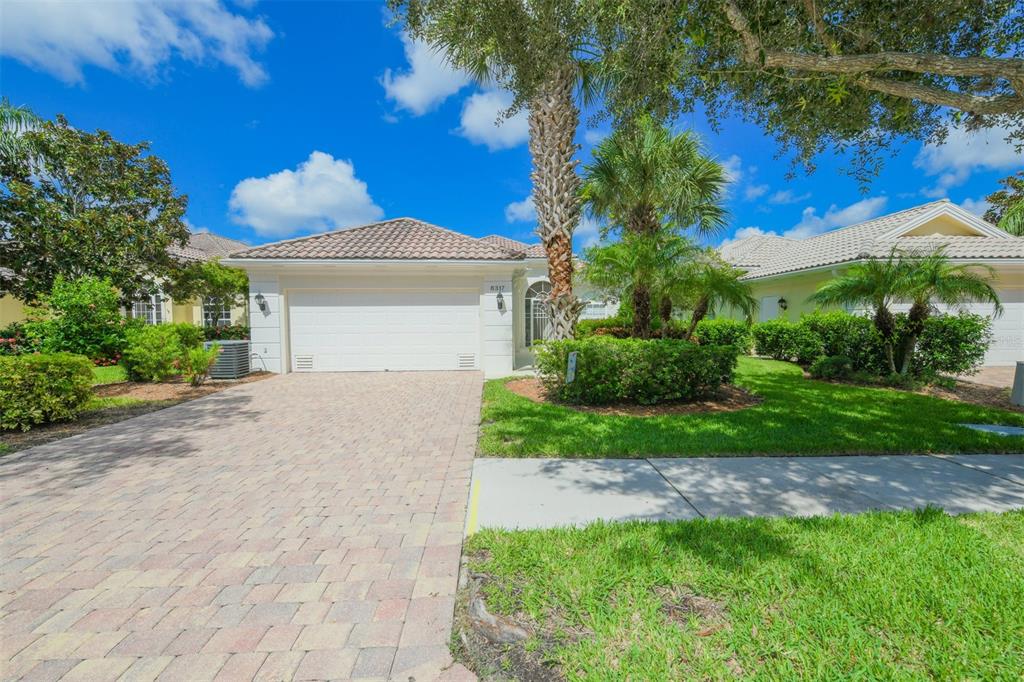 8317 Jesolo Lane Sarasota, FL 34238 - Photo 1 of 1 a front view of a house with garden