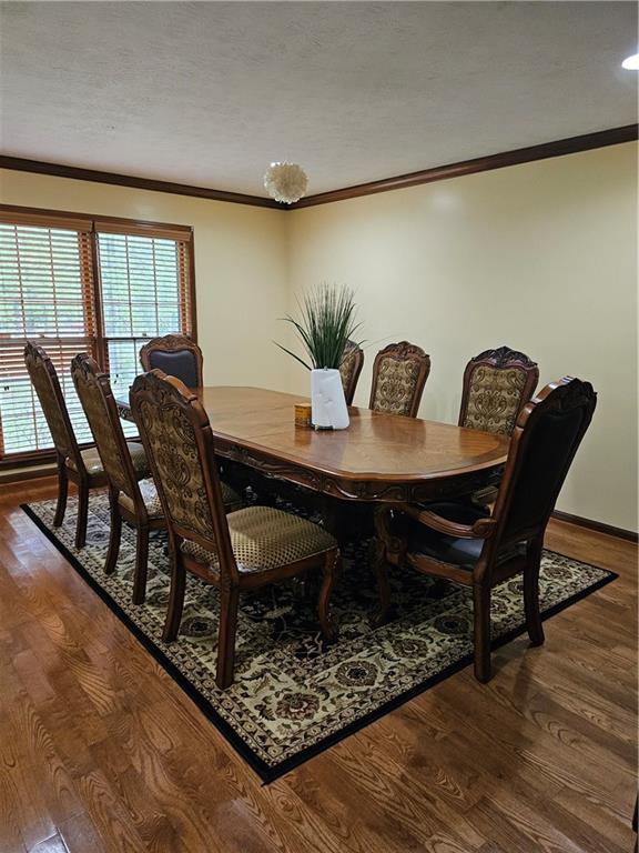 1935 Coventry Way Jonesboro, GA 30236 - Photo 12 of 33 a view of a dining room with furniture and wooden floor