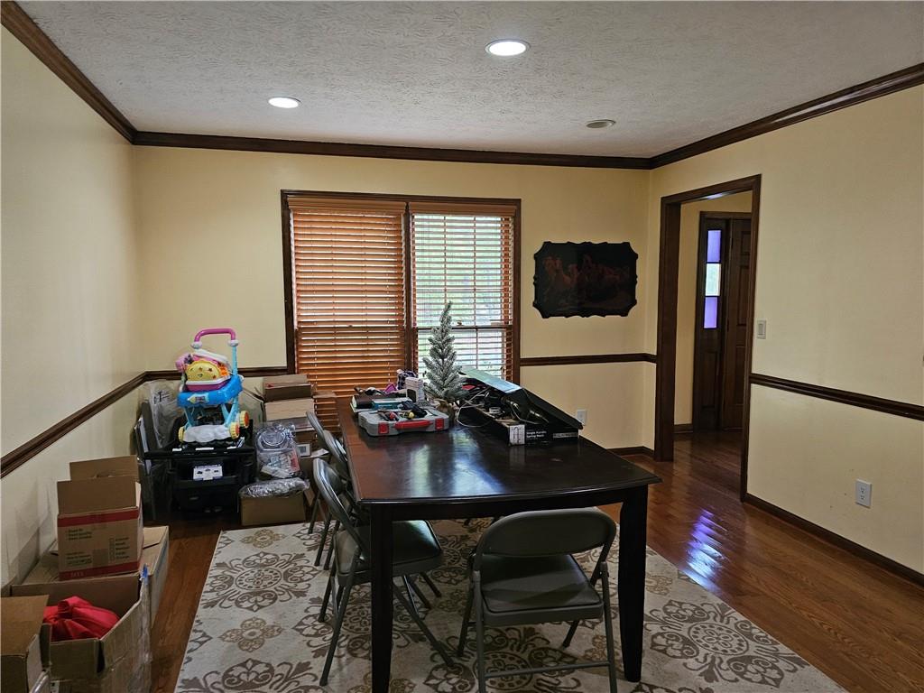 1935 Coventry Way Jonesboro, GA 30236 - Photo 15 of 33 a dining room with furniture and wooden floor