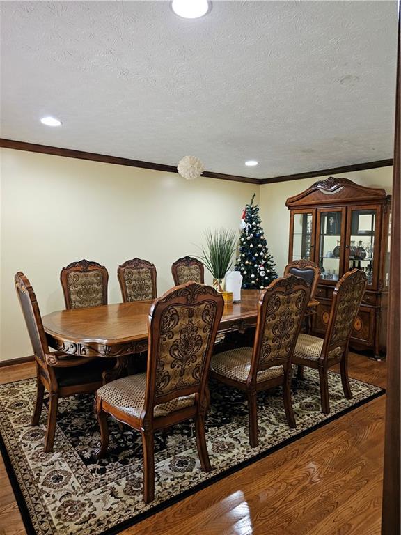 1935 Coventry Way Jonesboro, GA 30236 - Photo 17 of 33 a view of a dining room with furniture wooden floor and chandelier