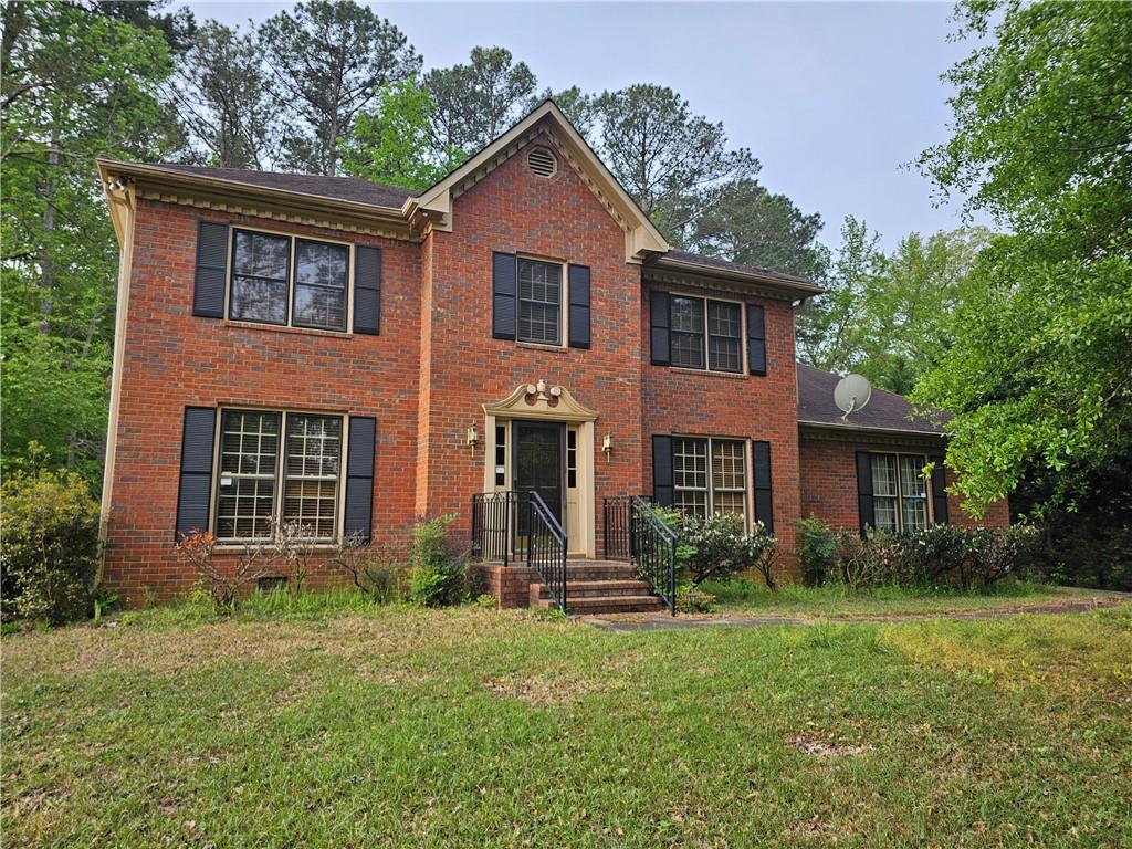 1935 Coventry Way Jonesboro, GA 30236 - Photo 2 of 33 front view of a house with a yard
