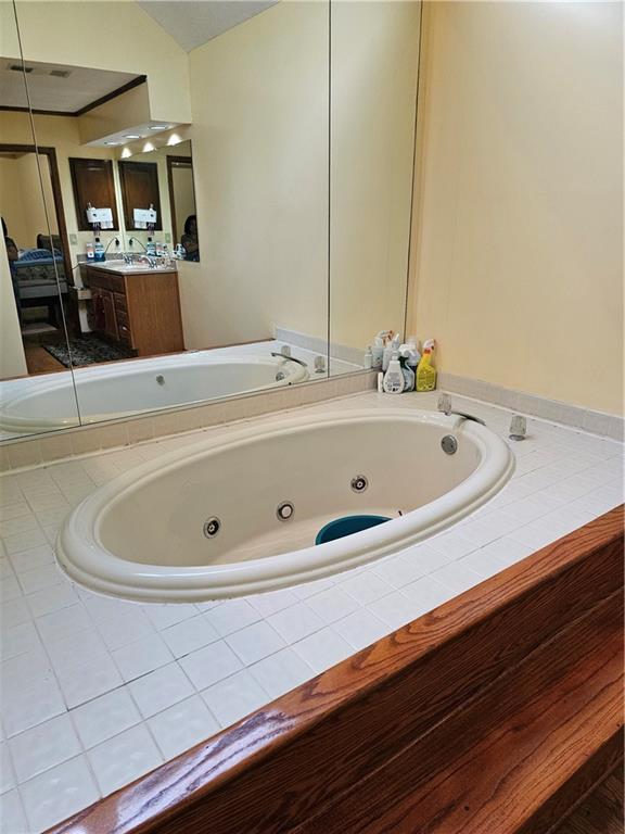 1935 Coventry Way Jonesboro, GA 30236 - Photo 26 of 33 a bathroom with a bathtub and sink