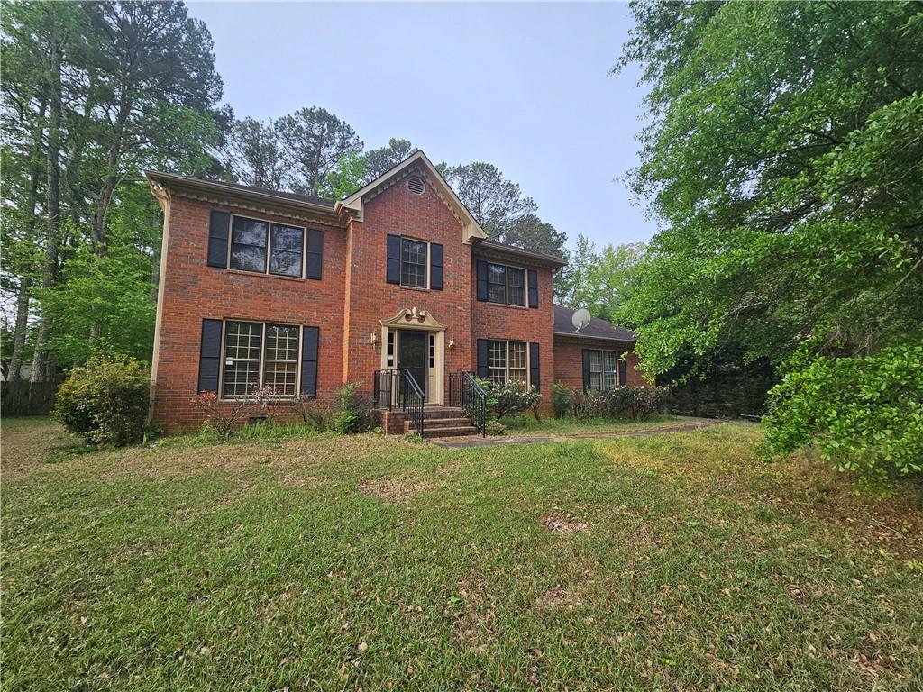 1935 Coventry Way Jonesboro, GA 30236 - Photo 3 of 33 a view of a house with a yard
