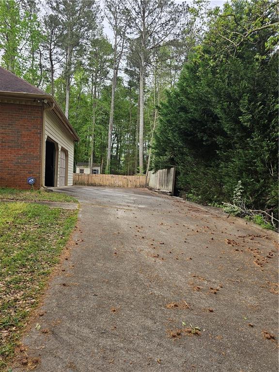 1935 Coventry Way Jonesboro, GA 30236 - Photo 4 of 33 a view of a house with backyard and trees