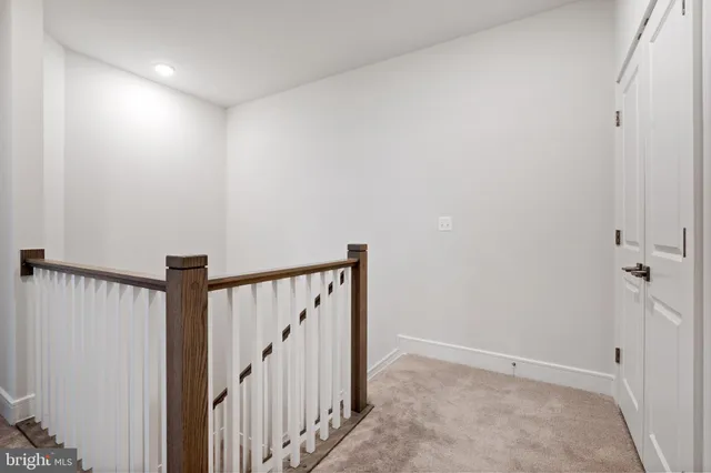 a view of a hallway with staircase