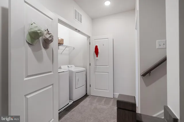 a view of hallway with washer and dryer