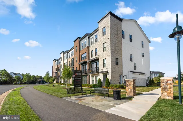 a view of a building with a yard