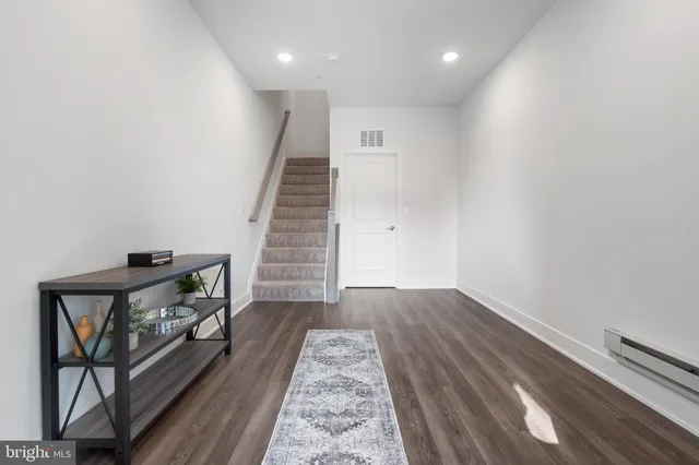 a view of entryway with wooden floor