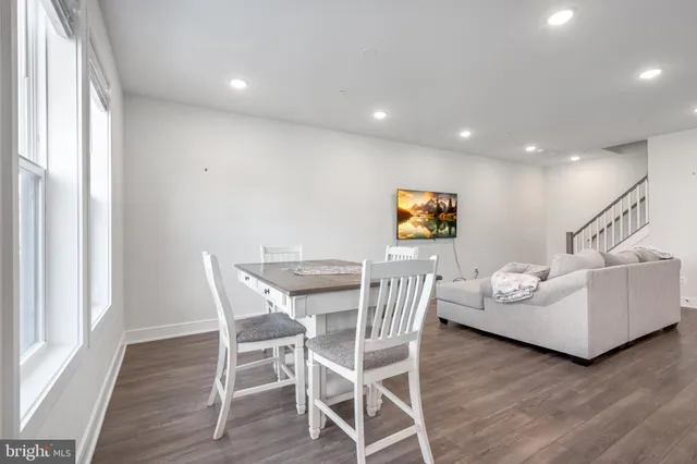 a view of a livingroom with furniture and wooden floor