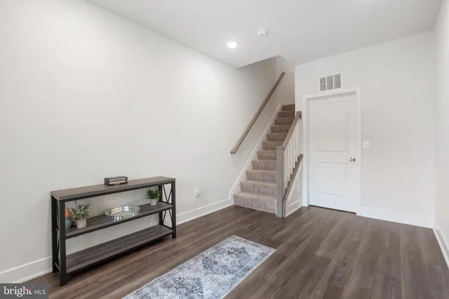 a view of entryway with wooden floor