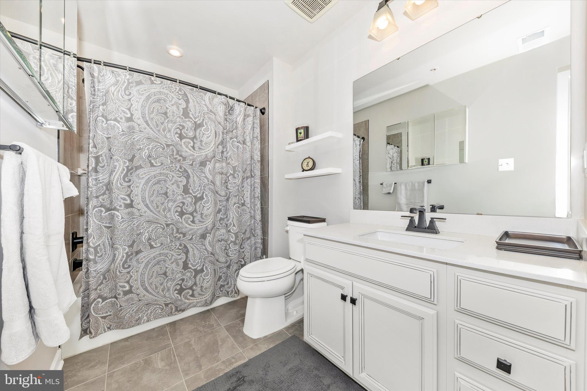6028 Calla Place Frederick, MD 21703 - Photo 30 of 46 Hall full bath with tile floor & tile tub-surround