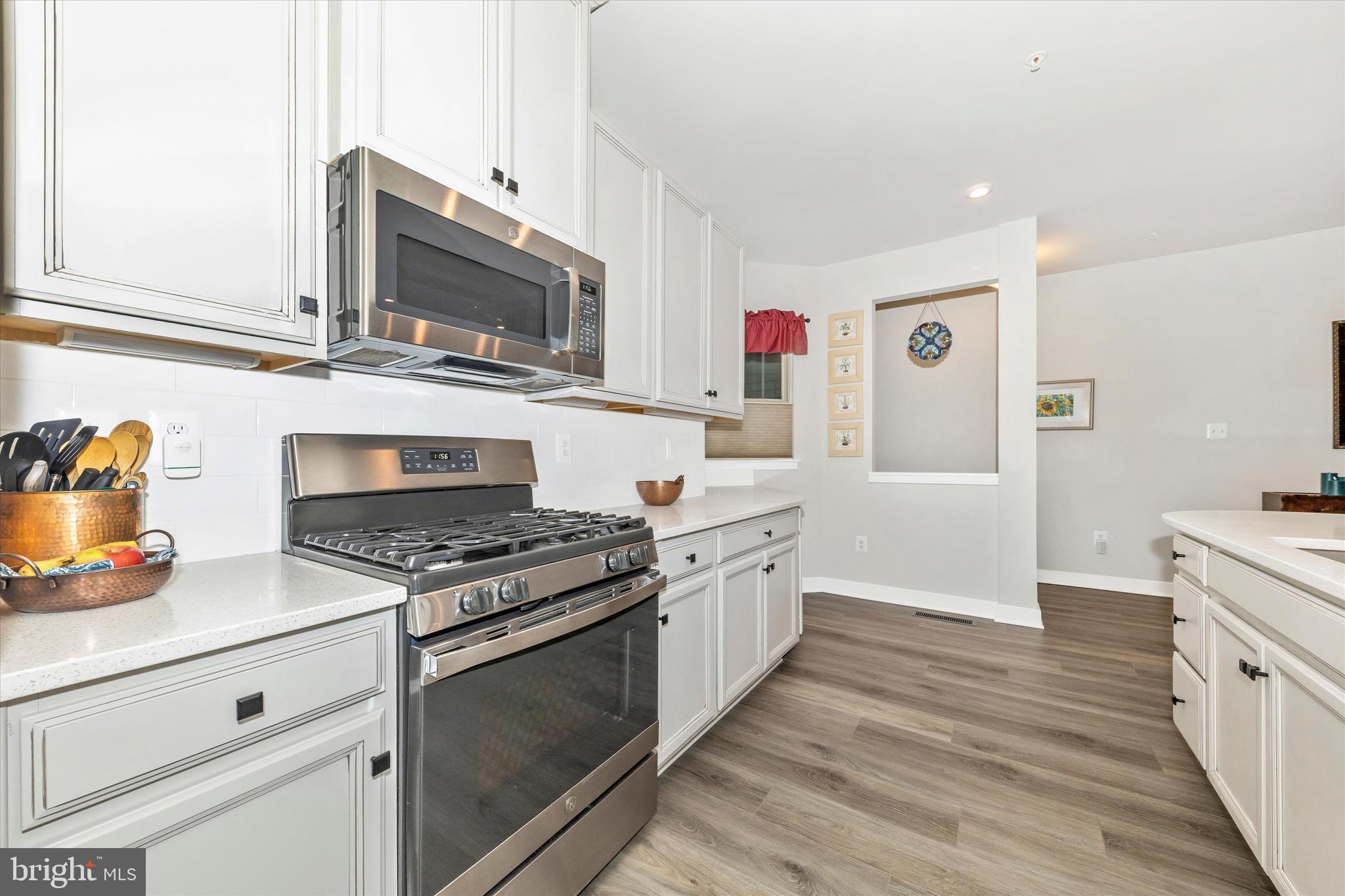 6028 Calla Place Frederick, MD 21703 - Photo 8 of 46 Gas range and French door refrigerator