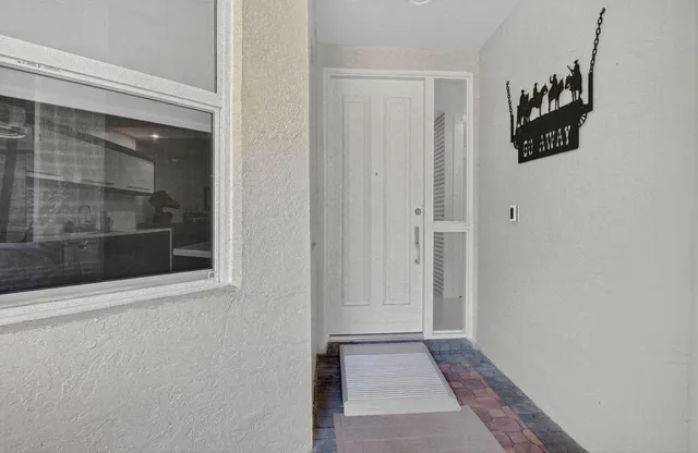 $989,000 | 2584 Coco Plum Boulevard, Unit 104, Boca Raton, FL 33496