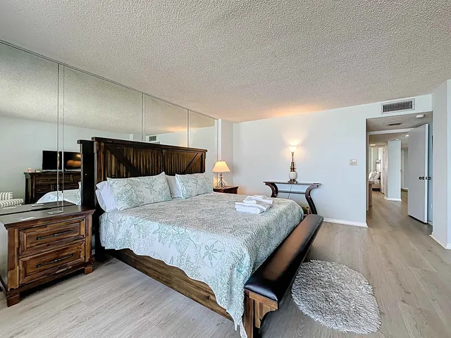 a bedroom with bed and walk in closet