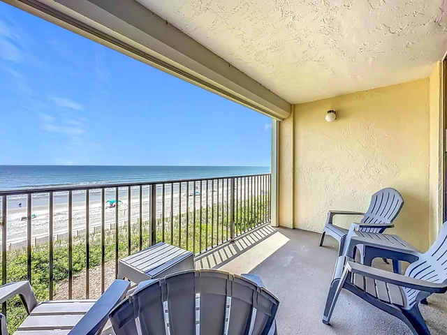 a view of a balcony with chair