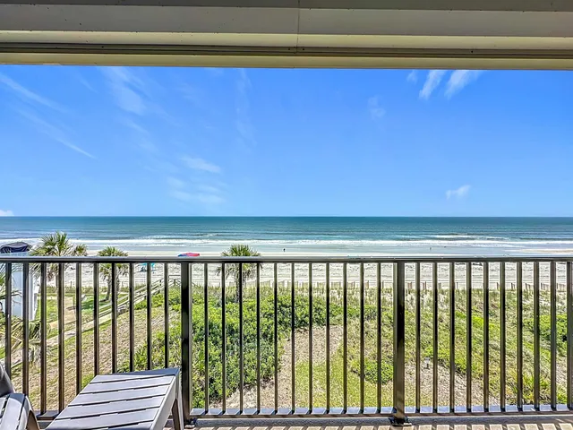 a view of a city street from a balcony