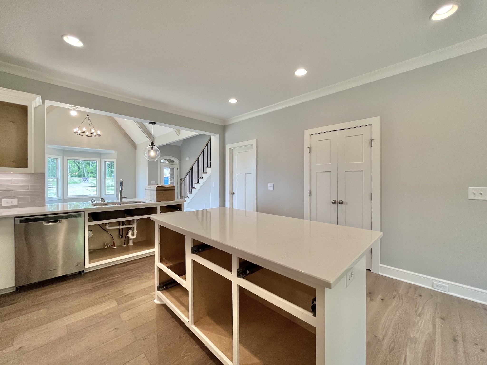 808 Ridgestone Place, Unit 105C Lebanon, TN 37087 - Photo 12 of 25 a kitchen with stainless steel appliances white cabinets and wooden floor