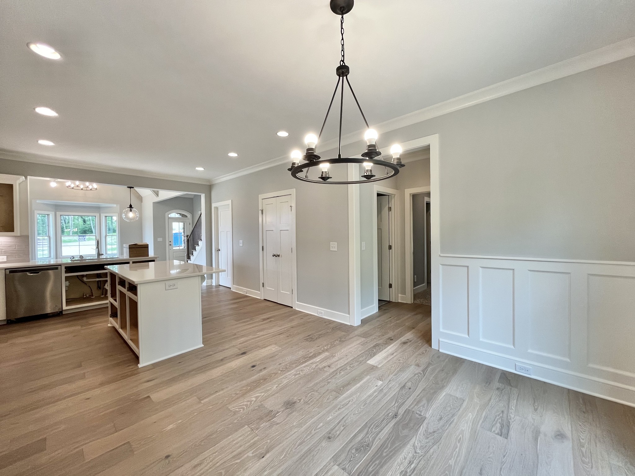 808 Ridgestone Place, Unit 105C Lebanon, TN 37087 - Photo 13 of 25 a view of a room with wooden floor kitchen chandelier and windows