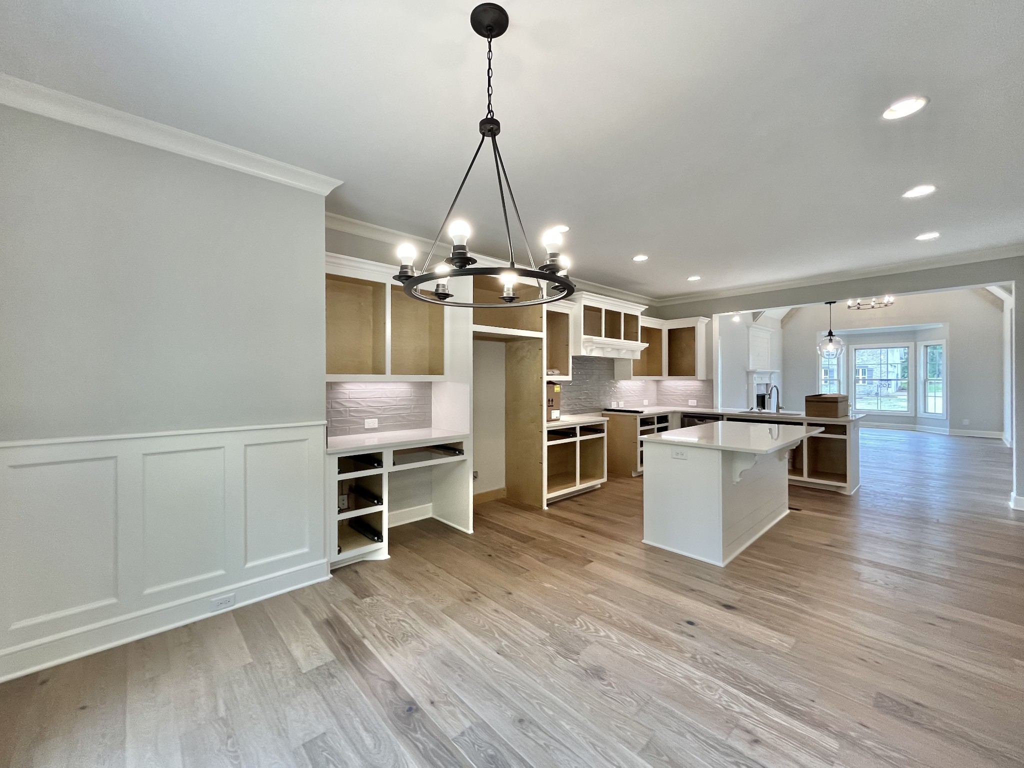 808 Ridgestone Place, Unit 105C Lebanon, TN 37087 - Photo 14 of 25 a view of a kitchen with kitchen island a sink stainless steel appliances and cabinets