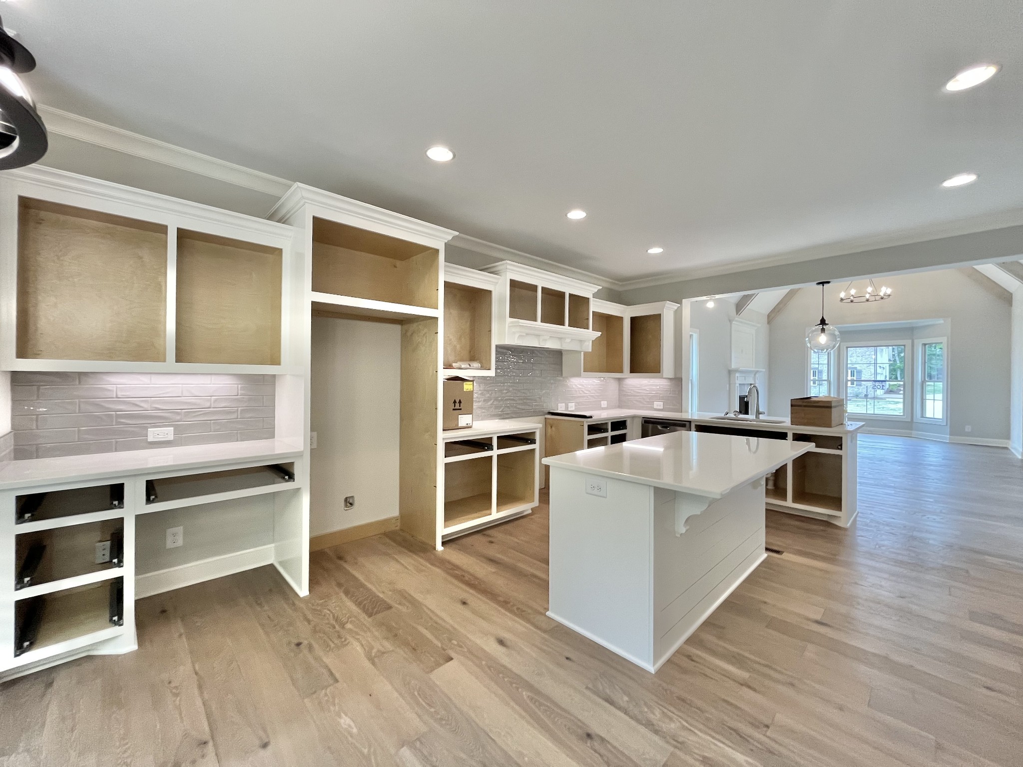 808 Ridgestone Place, Unit 105C Lebanon, TN 37087 - Photo 15 of 25 a living room with stainless steel appliances kitchen island wooden floors and living room view