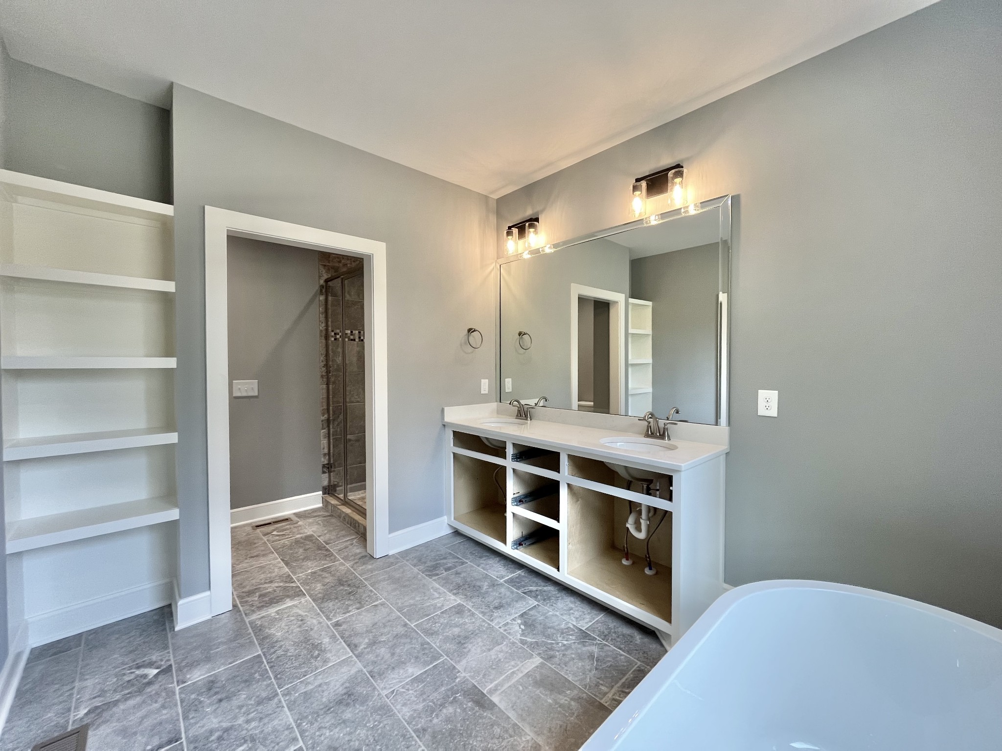 808 Ridgestone Place, Unit 105C Lebanon, TN 37087 - Photo 21 of 25 a view of a double vanity sink and a mirror