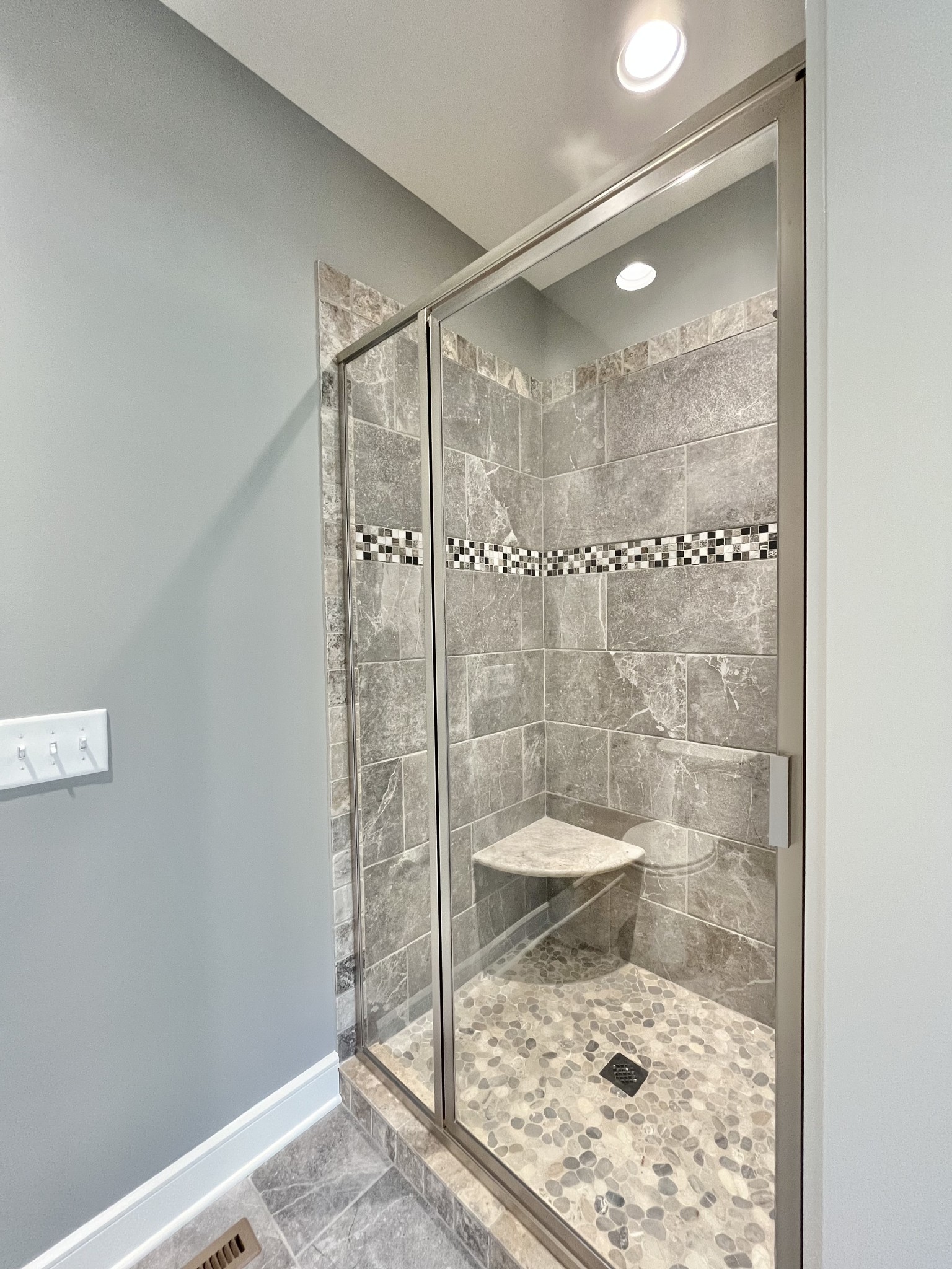 808 Ridgestone Place, Unit 105C Lebanon, TN 37087 - Photo 23 of 25 a bathroom with a glass shower door