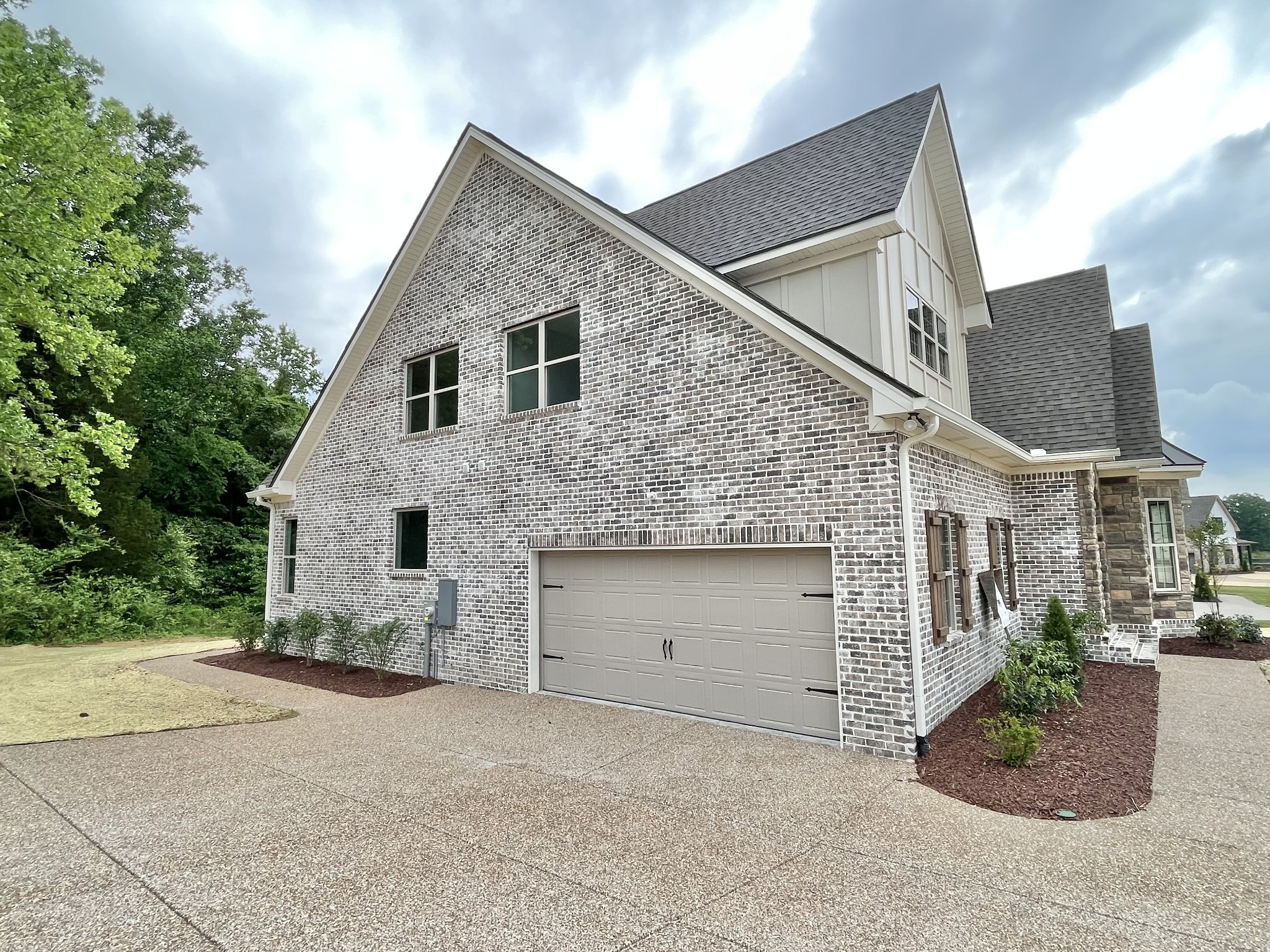 808 Ridgestone Place, Unit 105C Lebanon, TN 37087 - Photo 25 of 25 a view of a white house next to yard