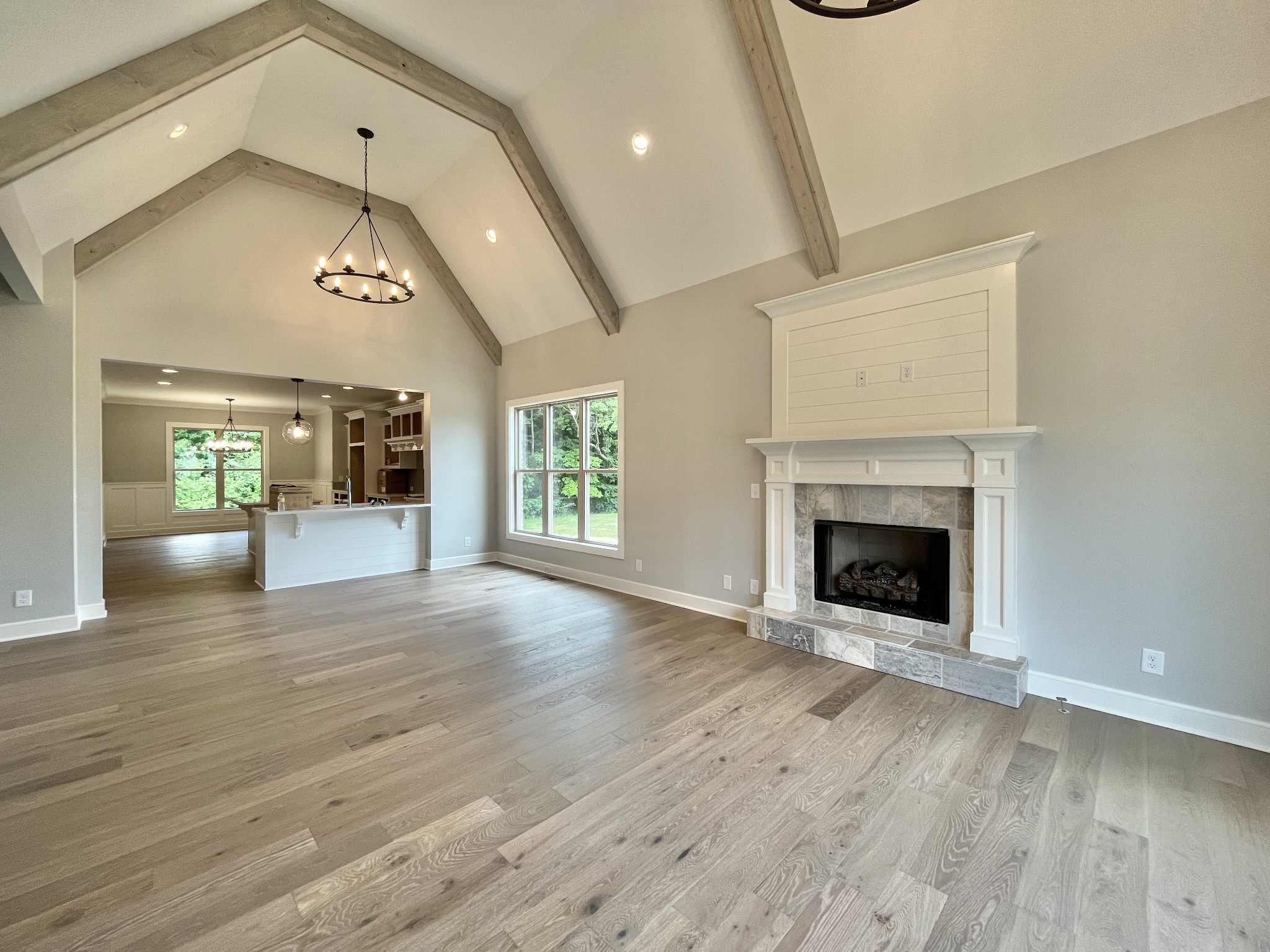 808 Ridgestone Place, Unit 105C Lebanon, TN 37087 - Photo 4 of 25 an empty room with wooden floor a fireplace and windows