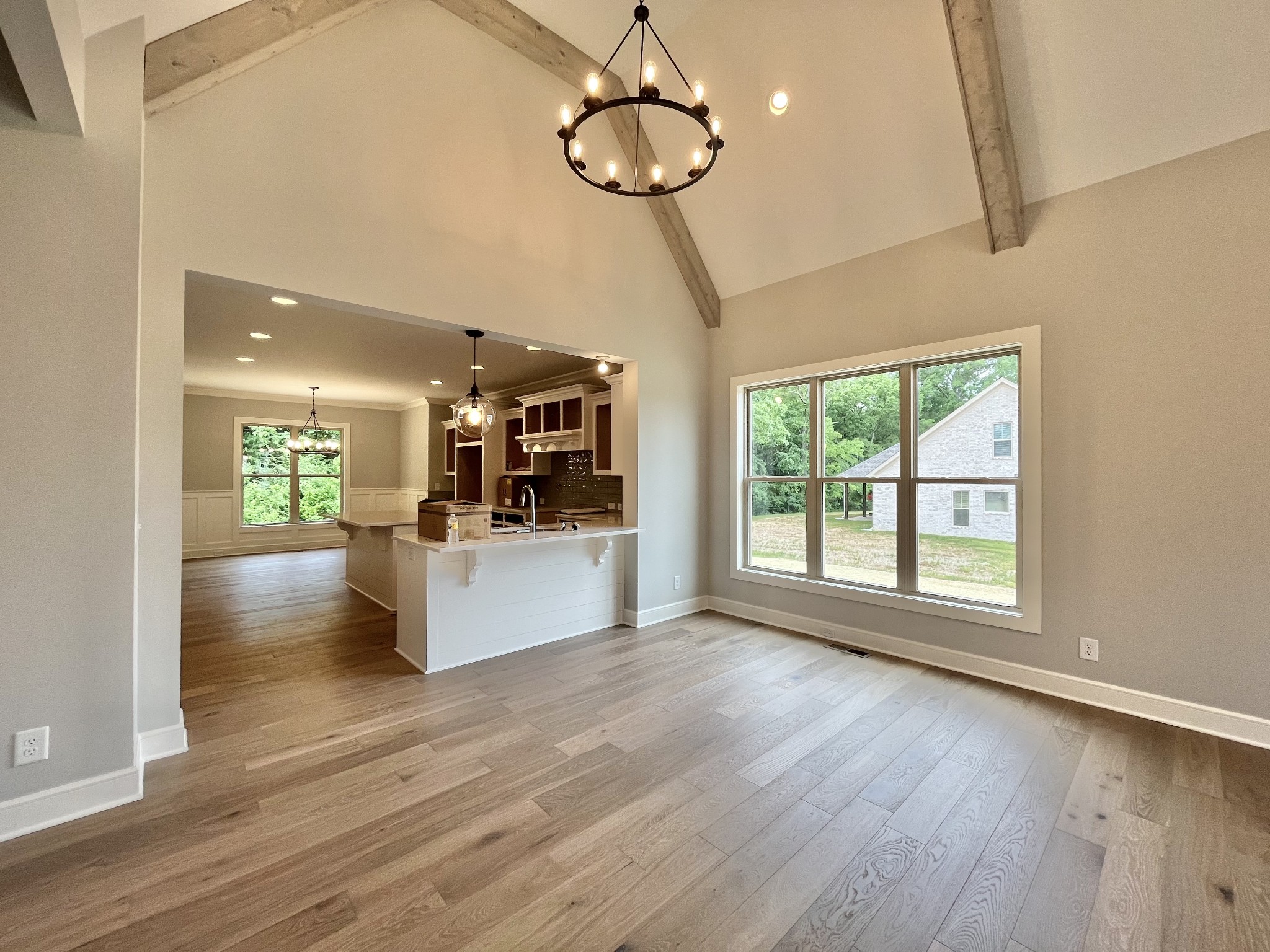 808 Ridgestone Place, Unit 105C Lebanon, TN 37087 - Photo 5 of 25 a view of an empty room with wooden floor and a window