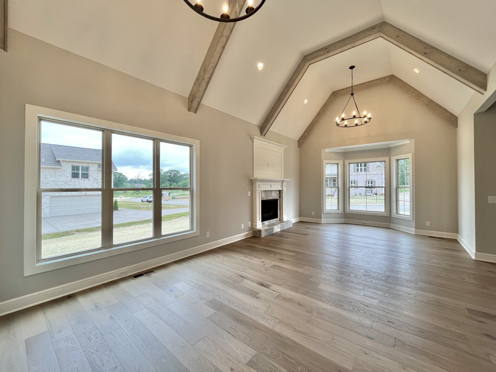 808 Ridgestone Place, Unit 105C Lebanon, TN 37087 - Photo 8 of 25 a view of an empty room with wooden floor and a window