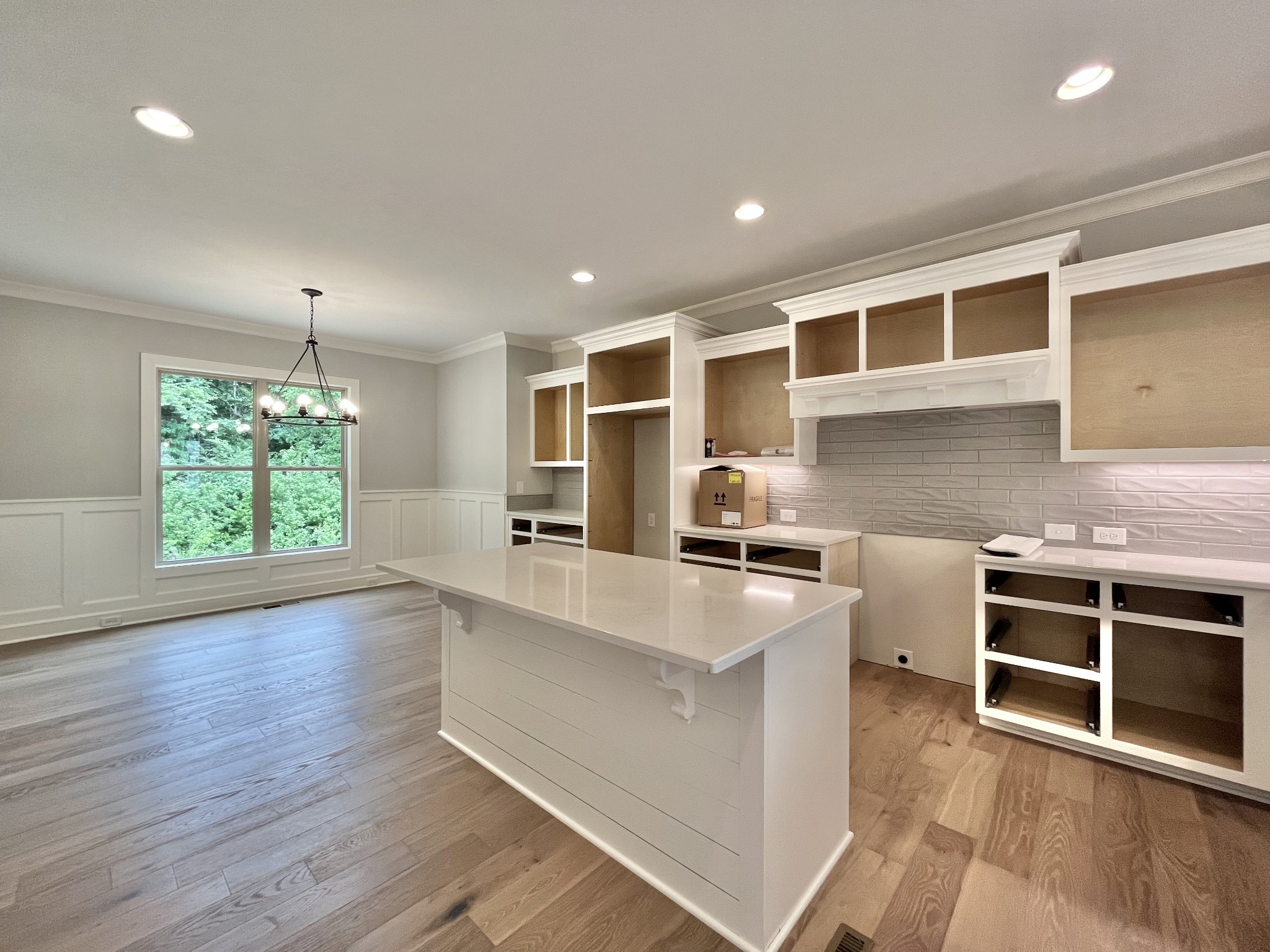 808 Ridgestone Place, Unit 105C Lebanon, TN 37087 - Photo 10 of 25 a large kitchen with stainless steel appliances granite countertop a stove a sink and a microwave