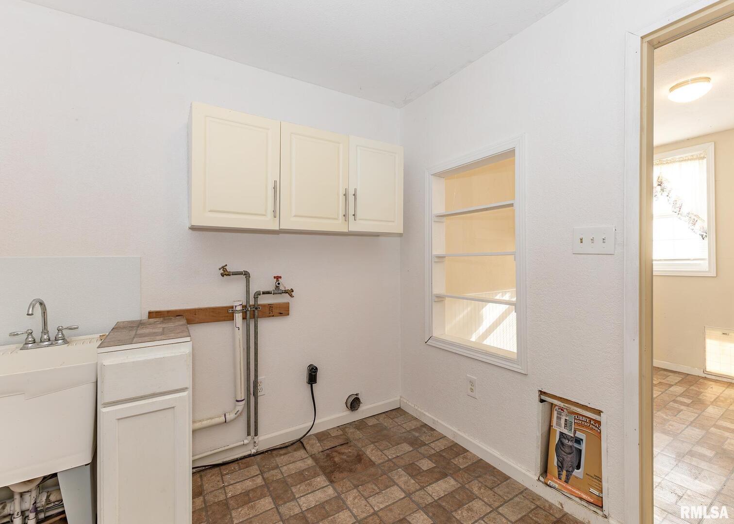 3015 North 3rd Street Clinton, IA 52732 - Photo 11 of 28 a view of a room with storage and utility