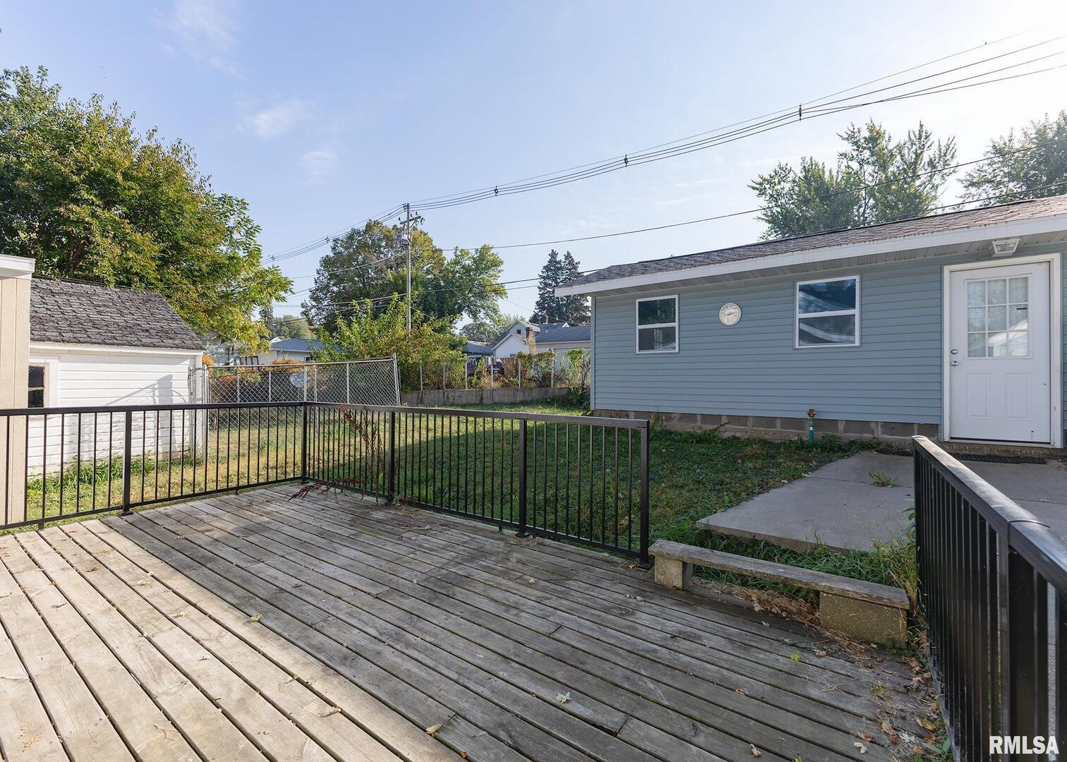 3015 North 3rd Street Clinton, IA 52732 - Photo 22 of 28 a view of a backyard with a garden