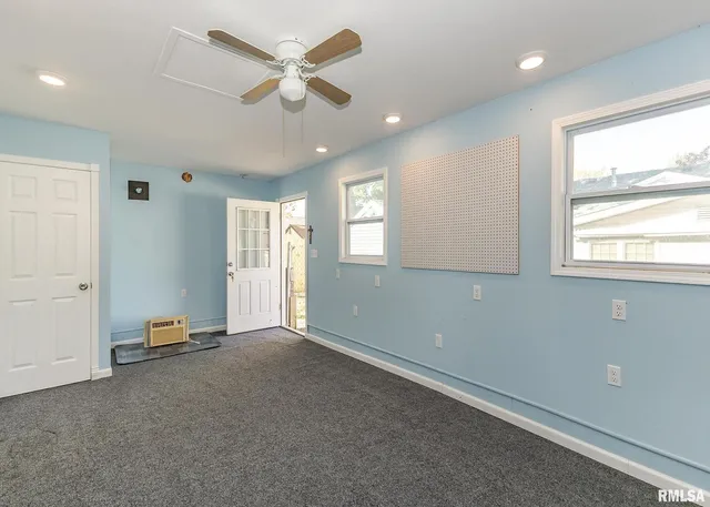 a view of an empty room with a window