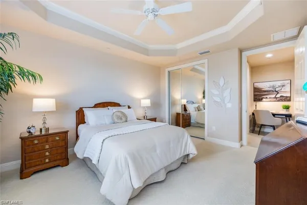 a bedroom with a bed and a cabinets