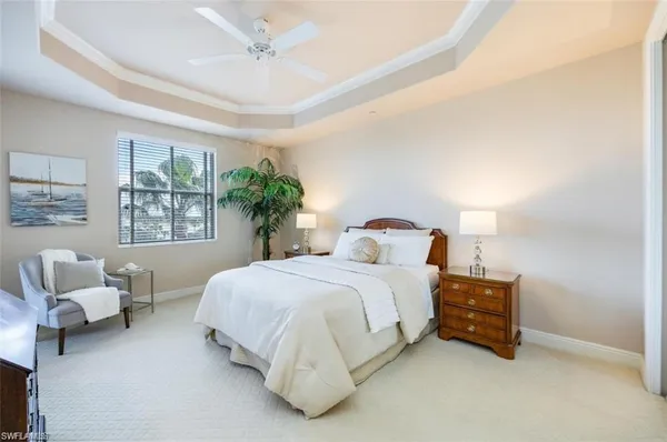 a bedroom with bed and window